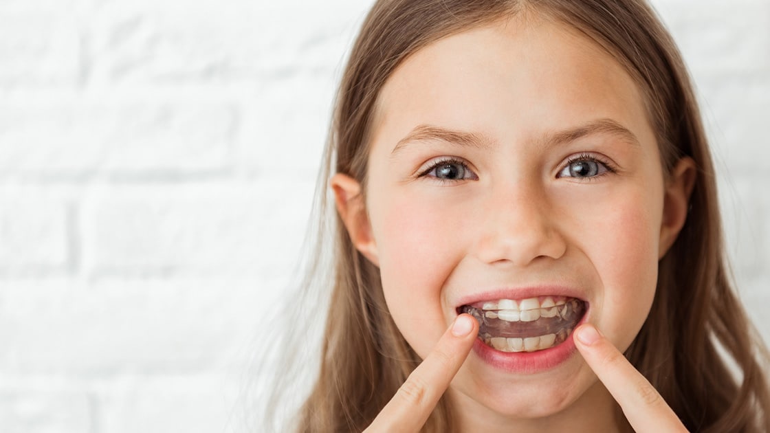 Child with retainer