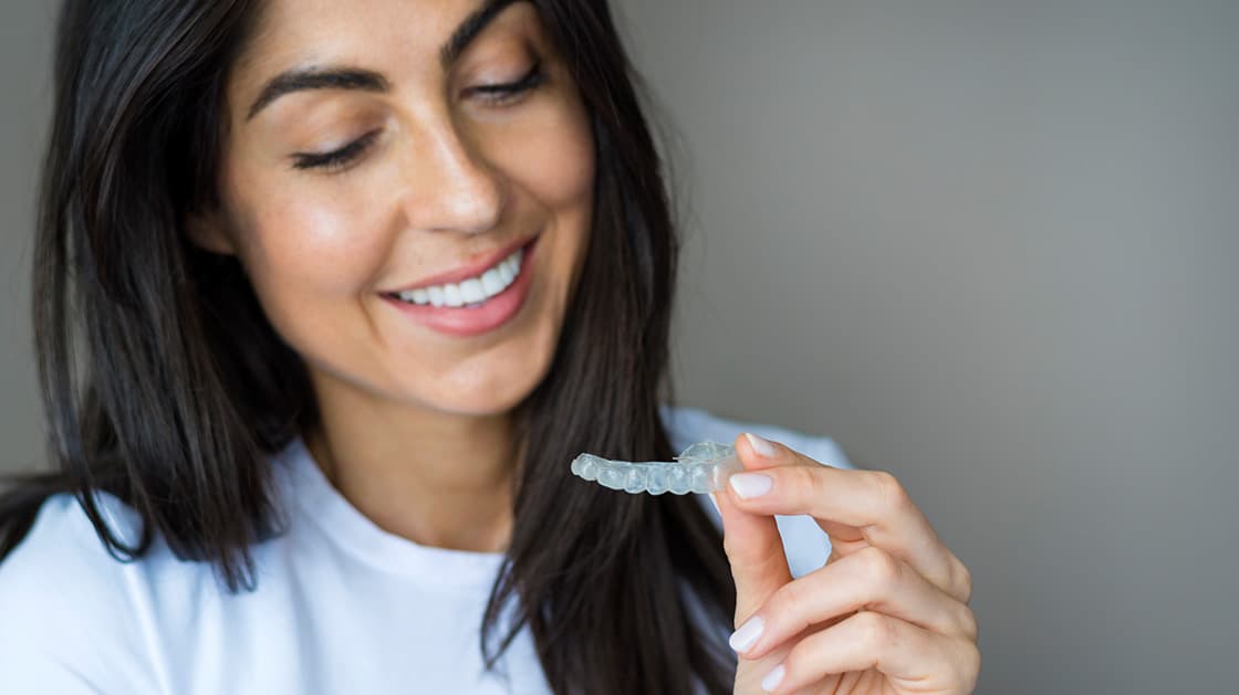 Woman with clear aligner
